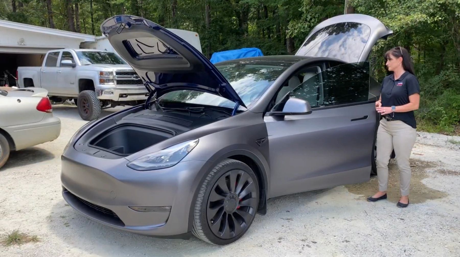 A Tesla Model Y with its power frunk open